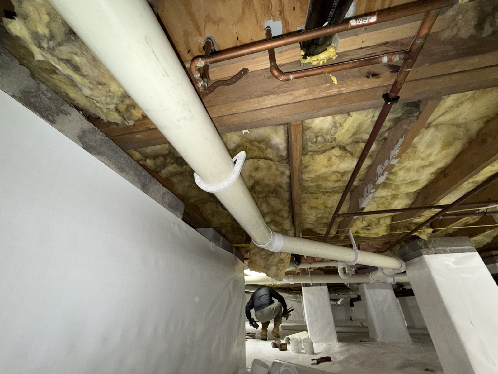 Drain lines rerouted overhead.