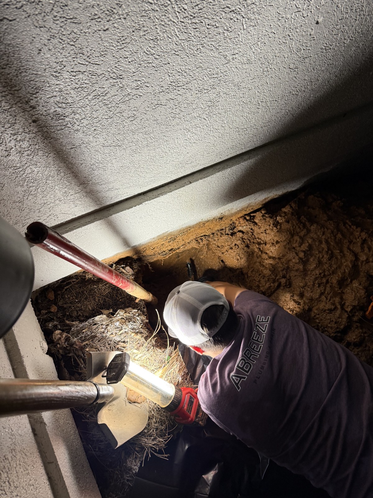 Down to the pipe, by hand.